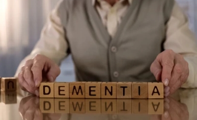 old man with dementia wooden blocks