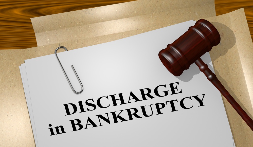 3d illustration of discharge in bankruptcy title on legal document