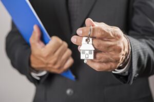 real estate agent handing over house keys